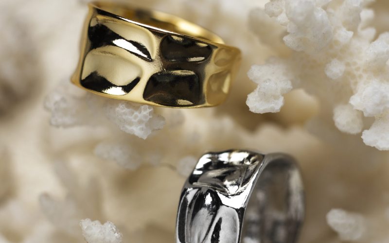 expensive-golden-ring-displayed-white-coral-background expensive-golden-ring-displayed-white-coral-background